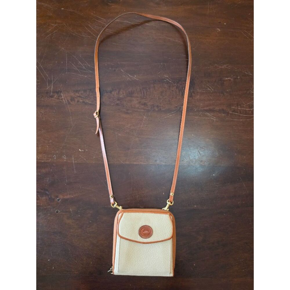 vintage Dooney & Bourke All Weather Leather Zip-Along Crossbody Wallet Cream